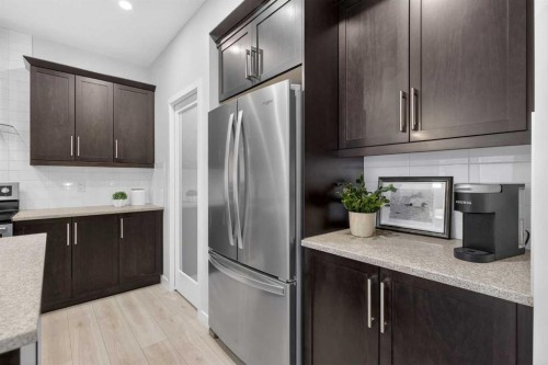 218 Riviera View, Cochrane, AB - Indoor Photo Showing Kitchen With Stainless Steel Kitchen