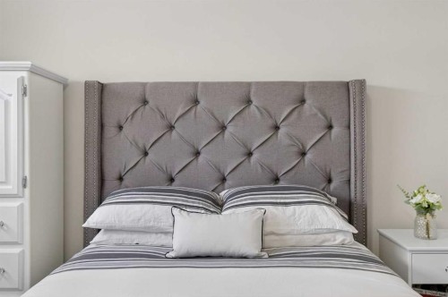 218 Riviera View, Cochrane, AB - Indoor Photo Showing Bedroom