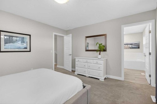 218 Riviera View, Cochrane, AB - Indoor Photo Showing Bedroom