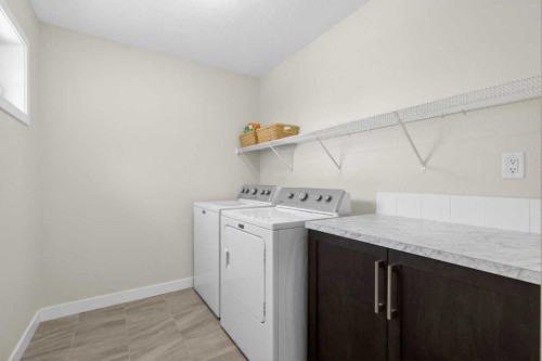 218 Riviera View, Cochrane, AB - Indoor Photo Showing Laundry Room