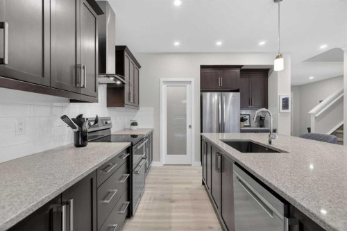 218 Riviera View, Cochrane, AB - Indoor Photo Showing Kitchen With Stainless Steel Kitchen With Upgraded Kitchen