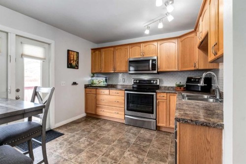 955 Erin Woods Drive Se, Calgary, AB - Indoor Photo Showing Kitchen With Double Sink