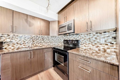 143-300 Marina Drive, Chestermere, AB - Indoor Photo Showing Kitchen With Upgraded Kitchen