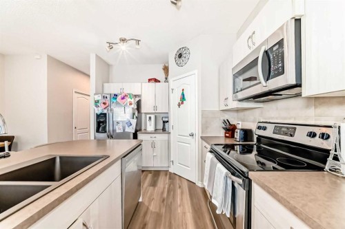234 Legacy Mews Se, Calgary, AB - Indoor Photo Showing Kitchen With Stainless Steel Kitchen With Double Sink