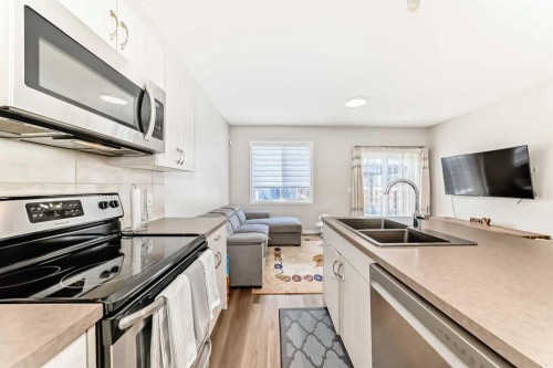 234 Legacy Mews Se, Calgary, AB - Indoor Photo Showing Kitchen With Stainless Steel Kitchen With Double Sink