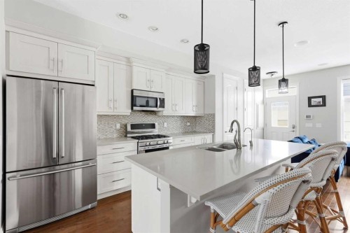 230 Quarry Park Boulevard Se, Calgary, AB - Indoor Photo Showing Kitchen With Stainless Steel Kitchen With Double Sink With Upgraded Kitchen