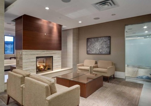 414-222 Riverfront Avenue Sw, Calgary, AB - Indoor Photo Showing Living Room With Fireplace