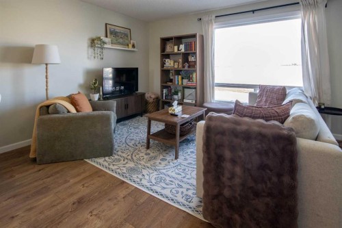 203 Clover Way, Carstairs, AB - Indoor Photo Showing Living Room