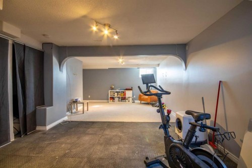 203 Clover Way, Carstairs, AB - Indoor Photo Showing Gym Room