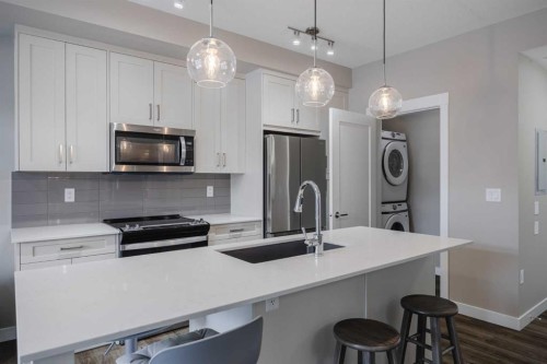 210-25 Walgrove Walk Se, Calgary, AB - Indoor Photo Showing Kitchen With Upgraded Kitchen
