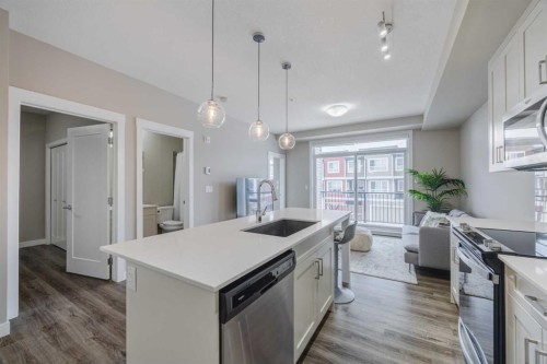 210-25 Walgrove Walk Se, Calgary, AB - Indoor Photo Showing Kitchen With Upgraded Kitchen