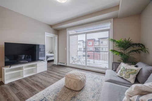 210-25 Walgrove Walk Se, Calgary, AB - Indoor Photo Showing Living Room