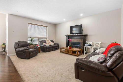 79 Pantego Way Nw, Calgary, AB - Indoor Photo Showing Living Room With Fireplace