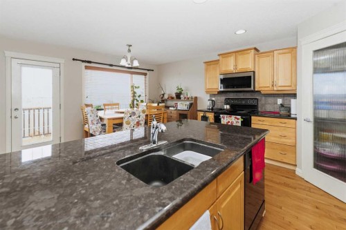 50 Panamount View Nw, Calgary, AB - Indoor Photo Showing Kitchen With Double Sink