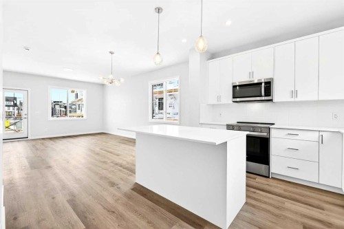 101-40 Creekside Way Sw, Calgary, AB - Indoor Photo Showing Kitchen With Upgraded Kitchen