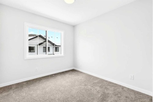 101-40 Creekside Way Sw, Calgary, AB - Indoor Photo Showing Other Room