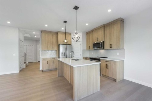 122 Sandpiper Bend, Chestermere, AB - Indoor Photo Showing Kitchen With Upgraded Kitchen