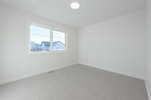 122 Sandpiper Bend, Chestermere, AB - Indoor Photo Showing Other Room