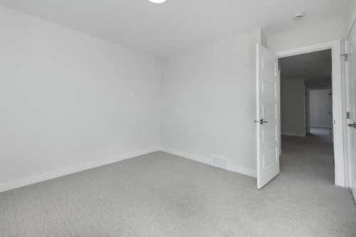 122 Sandpiper Bend, Chestermere, AB - Indoor Photo Showing Other Room