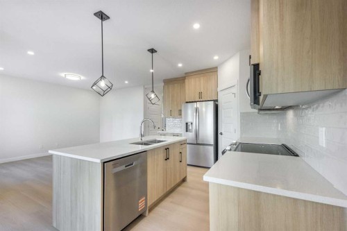 122 Sandpiper Bend, Chestermere, AB - Indoor Photo Showing Kitchen With Double Sink With Upgraded Kitchen