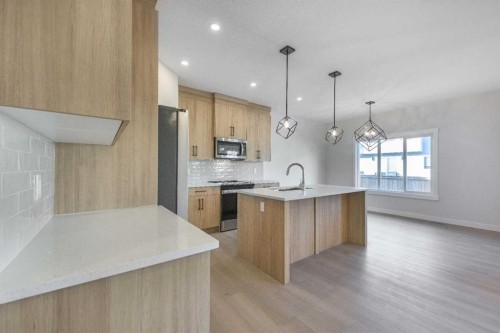 122 Sandpiper Bend, Chestermere, AB - Indoor Photo Showing Kitchen With Upgraded Kitchen