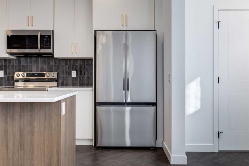 90 Agate Road, Cochrane, AB - Indoor Photo Showing Kitchen