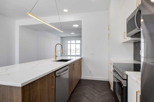 90 Agate Road, Cochrane, AB - Indoor Photo Showing Kitchen With Upgraded Kitchen