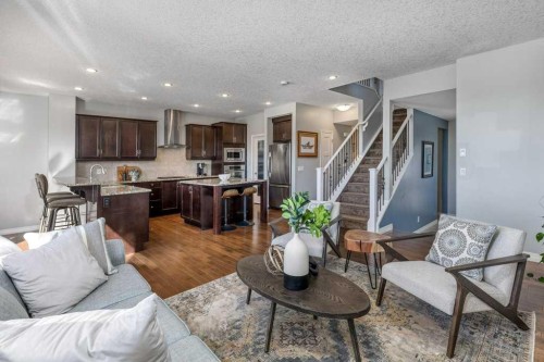 128 Sunset Park, Cochrane, AB - Indoor Photo Showing Living Room