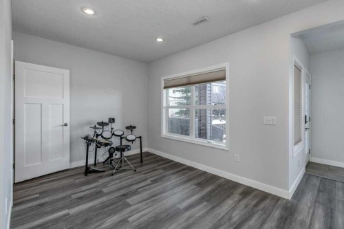 128 Sunset Park, Cochrane, AB - Indoor Photo Showing Other Room
