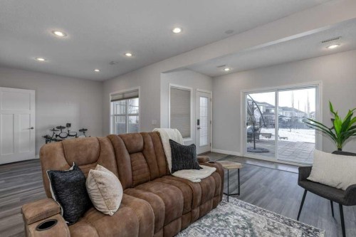 128 Sunset Park, Cochrane, AB - Indoor Photo Showing Living Room