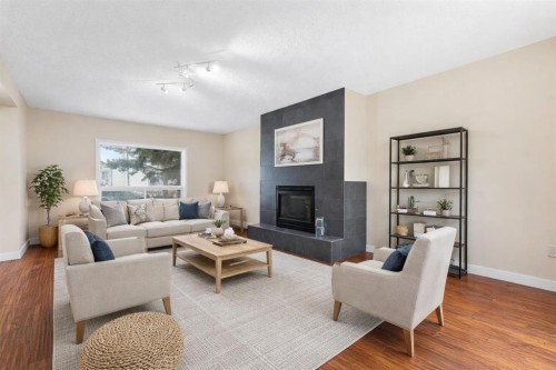 10603 Maplecreek Drive Se, Calgary, AB - Indoor Photo Showing Living Room With Fireplace