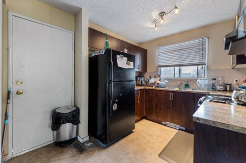 48 Falton Way Ne, Calgary, AB - Indoor Photo Showing Kitchen With Double Sink
