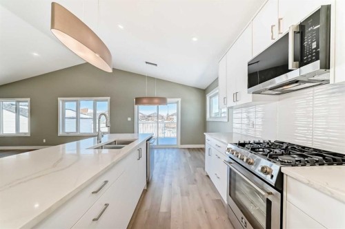 2017 30 Avenue, Nanton, AB - Indoor Photo Showing Kitchen With Double Sink With Upgraded Kitchen