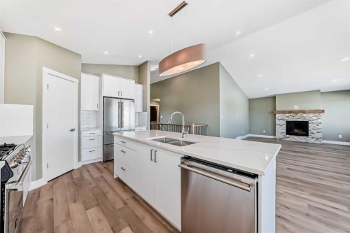 2017 30 Avenue, Nanton, AB - Indoor Photo Showing Kitchen With Stainless Steel Kitchen With Double Sink With Upgraded Kitchen