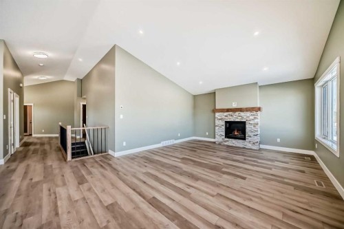 2017 30 Avenue, Nanton, AB - Indoor With Fireplace