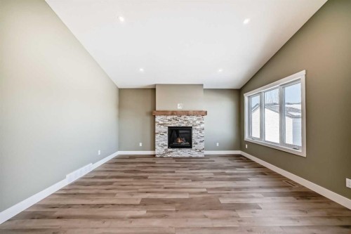 2017 30 Avenue, Nanton, AB - Indoor With Fireplace