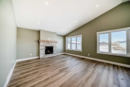 2017 30 Avenue, Nanton, AB - Indoor Photo Showing Living Room With Fireplace