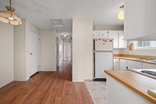 151 Deerview Court Se, Calgary, AB - Indoor Photo Showing Kitchen With Double Sink