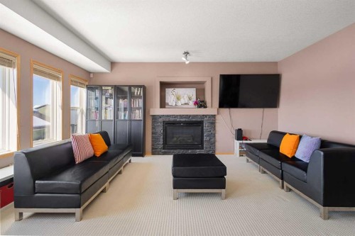 146 Panamount Villas Nw, Calgary, AB - Indoor Photo Showing Living Room With Fireplace
