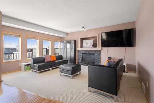 146 Panamount Villas Nw, Calgary, AB - Indoor Photo Showing Living Room With Fireplace