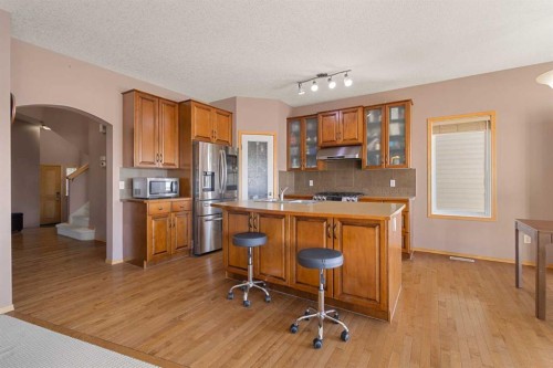 146 Panamount Villas Nw, Calgary, AB - Indoor Photo Showing Kitchen With Double Sink