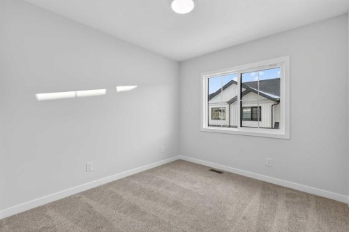 103-40 Creekside Way Sw, Calgary, AB - Indoor Photo Showing Other Room