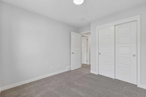 103-40 Creekside Way Sw, Calgary, AB - Indoor Photo Showing Other Room