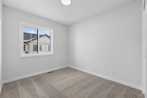 103-40 Creekside Way Sw, Calgary, AB - Indoor Photo Showing Other Room