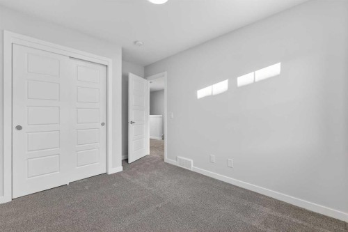 103-40 Creekside Way Sw, Calgary, AB - Indoor Photo Showing Other Room