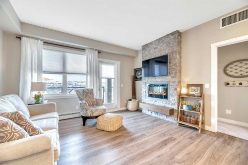 415-55 Wolf Hollow Crescent Se, Calgary, AB - Indoor Photo Showing Living Room With Fireplace