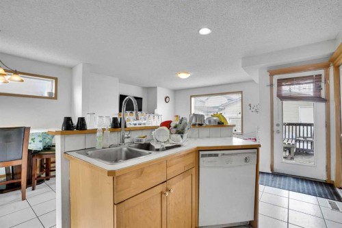 162 Taradale Drive Ne, Calgary, AB - Indoor Photo Showing Kitchen With Double Sink