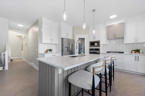 125 Seagreen Passage, Chestermere, AB - Indoor Photo Showing Kitchen With Stainless Steel Kitchen With Upgraded Kitchen