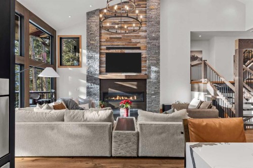 117 Silvertip Ridge, Canmore, AB - Indoor Photo Showing Living Room With Fireplace