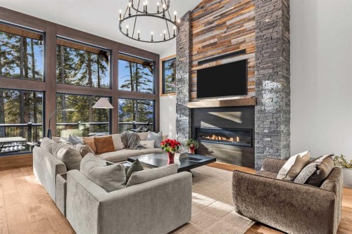 117 Silvertip Ridge, Canmore, AB - Indoor Photo Showing Living Room With Fireplace